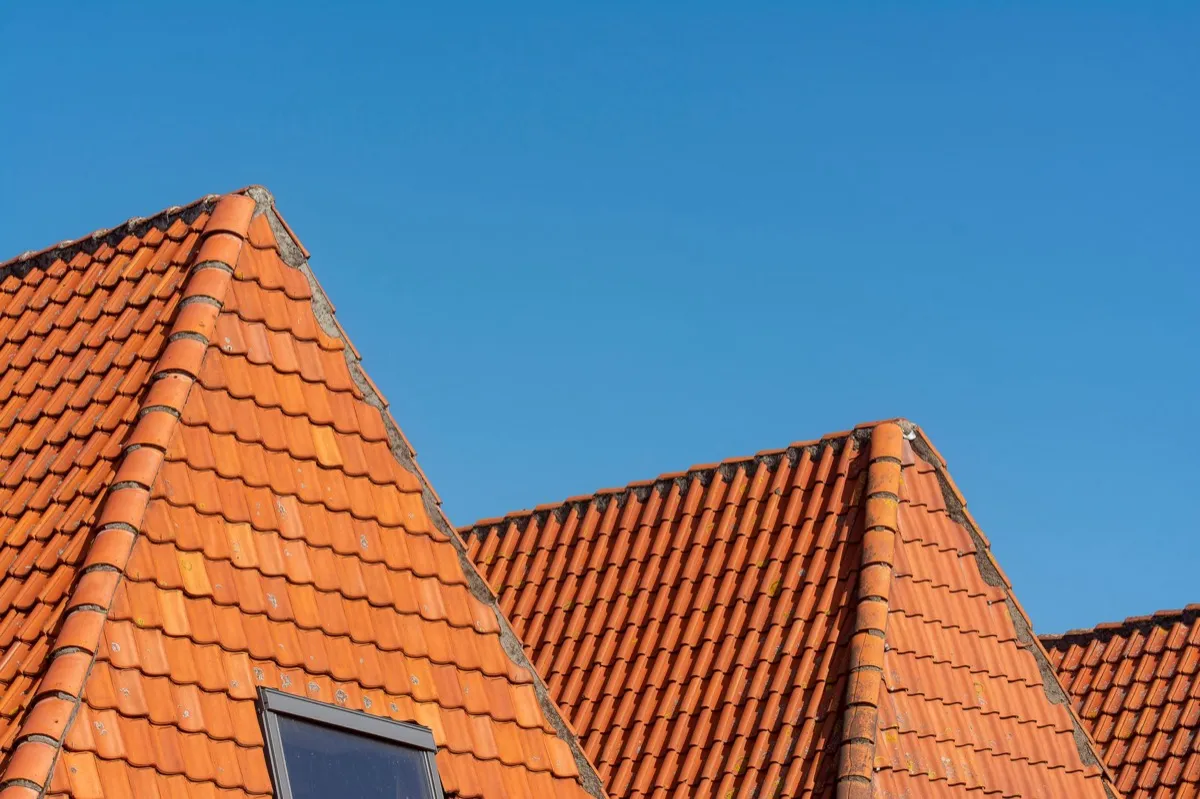 Clay barrel tile rooflines on homes in Dalton, GA